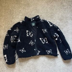 Fleece jacket with butterflies.